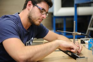 Student researcher aligning a tunnel traversing stage